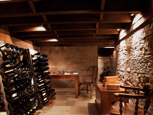 a home wine cellar with many different bottle of wine